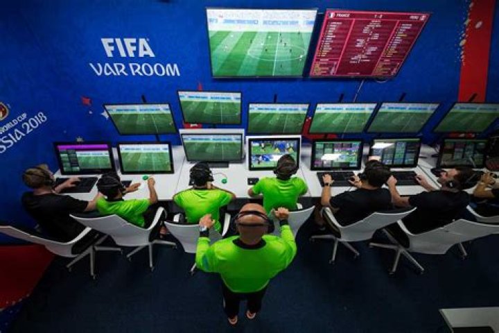 Where do var officials sit?